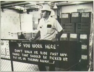 man in a hard hat working in coca cola factory