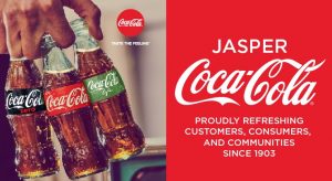 hand holding three types of coca cola