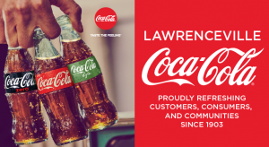 hand holding three types of coca cola