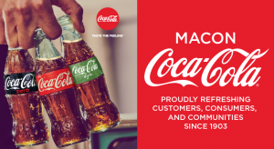 hand holding three types of coca cola