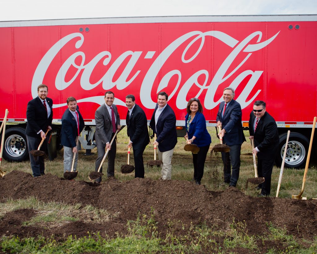 executives with shovels