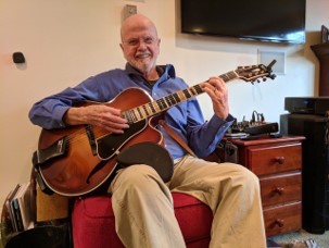 Allen with his guitar