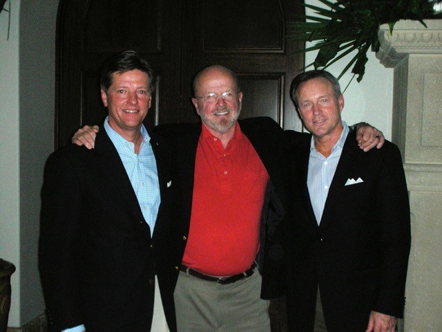 three of the family men posing for a photo