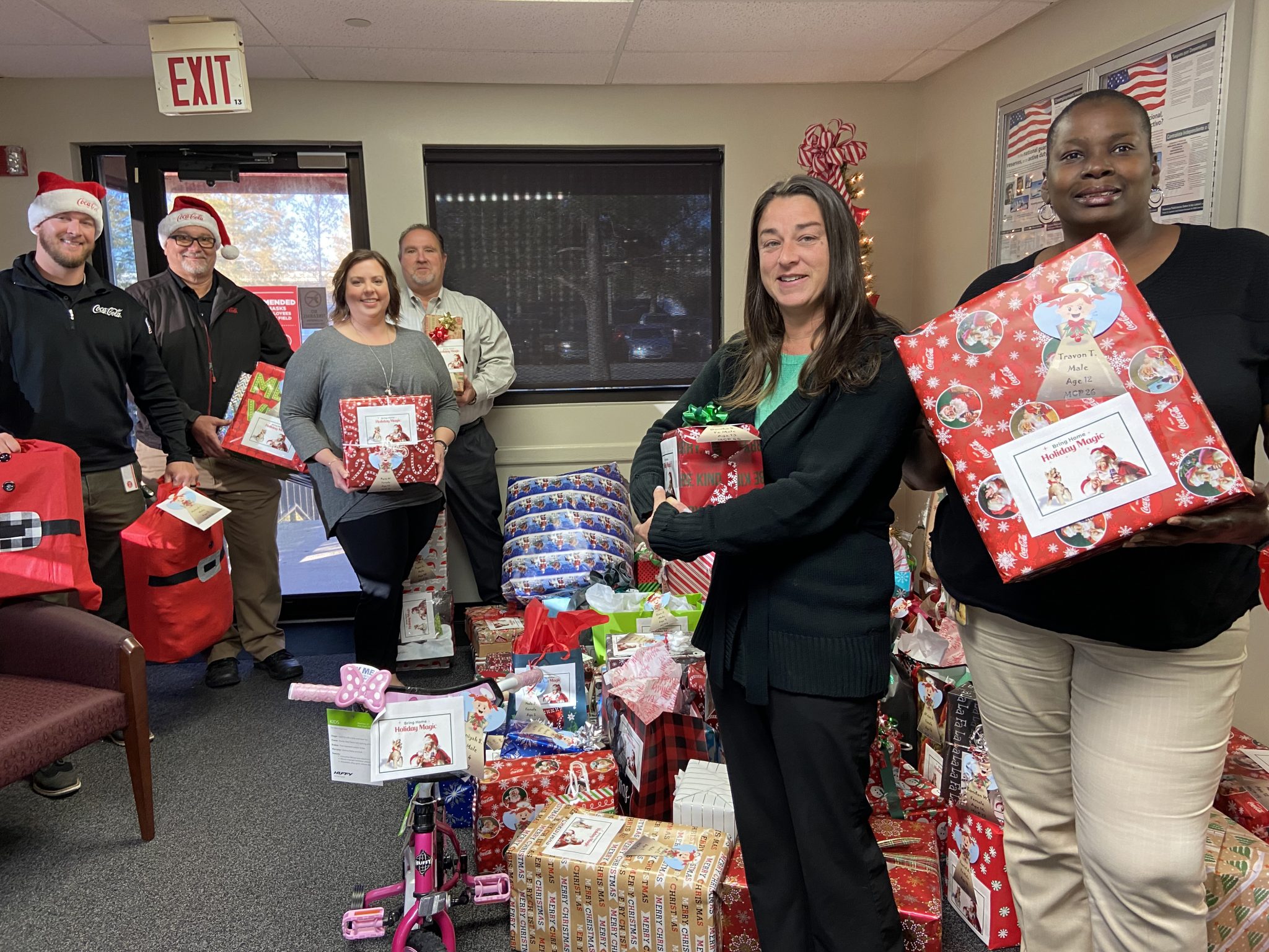 New Orleans CocaCola Employees Donate Holiday Gifts to Volunteers of